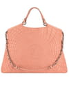 Sac en cuir surpiqué rose de Chanel Sac en cuir surpiqué rose de Chanel
